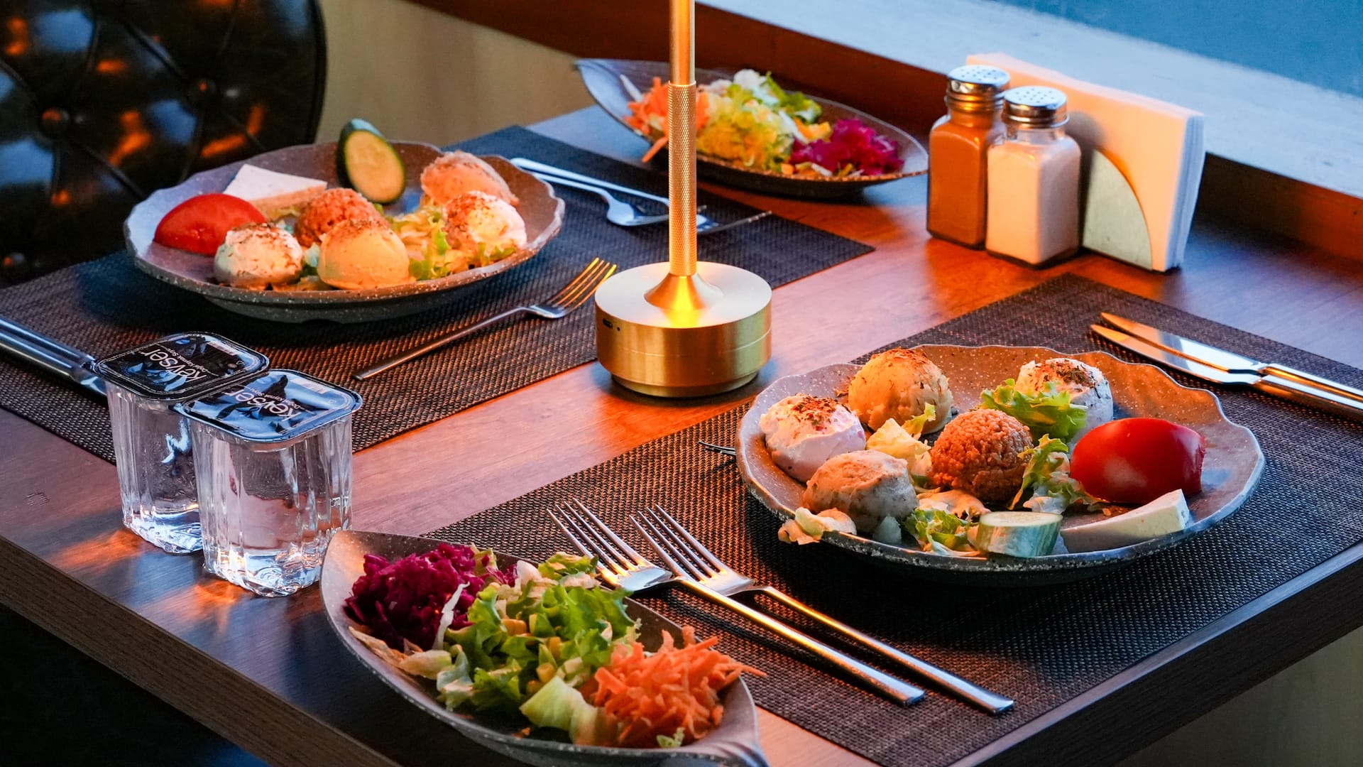 Turkish meze spread served on a candlelit Bosphorus dinner cruise table