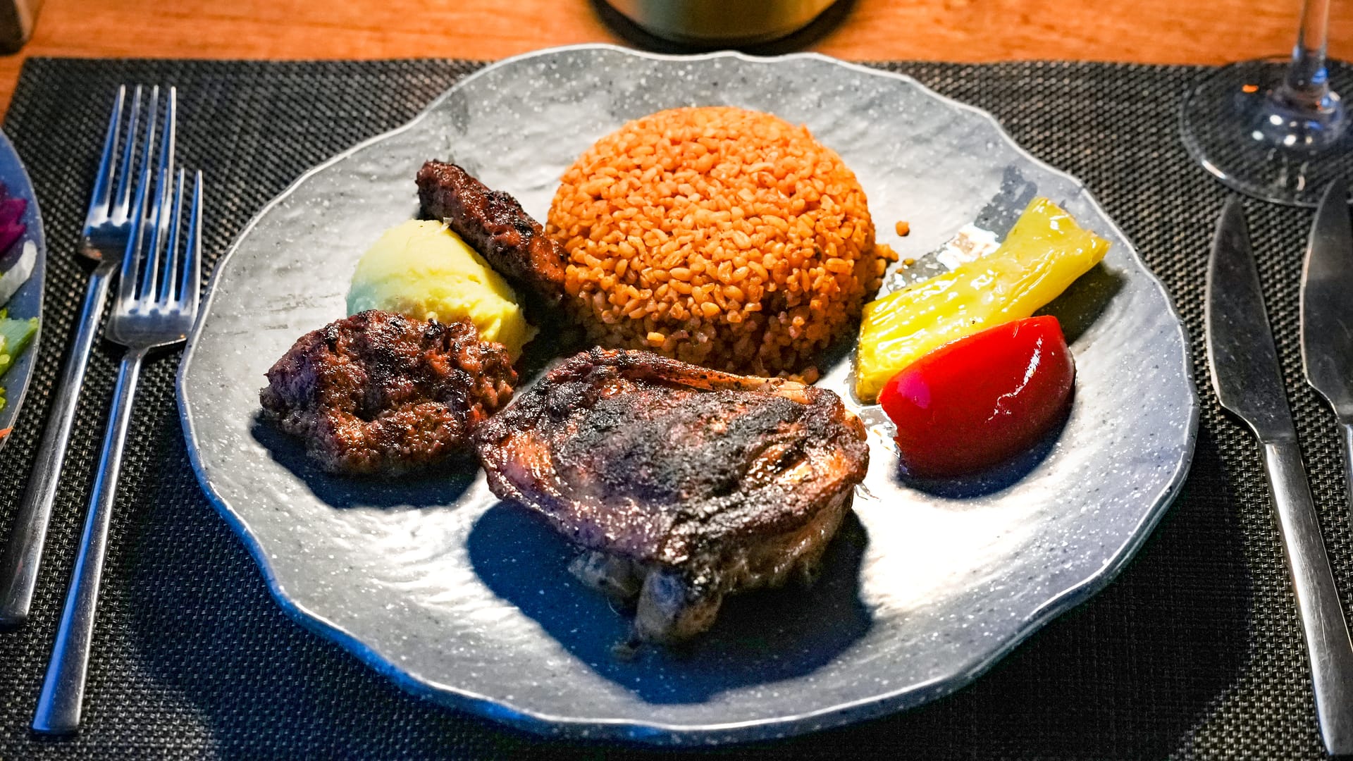 Mixed grill platter — köfte, lamb chop and bulgur pilaf — on a Bosphorus dinner cruise